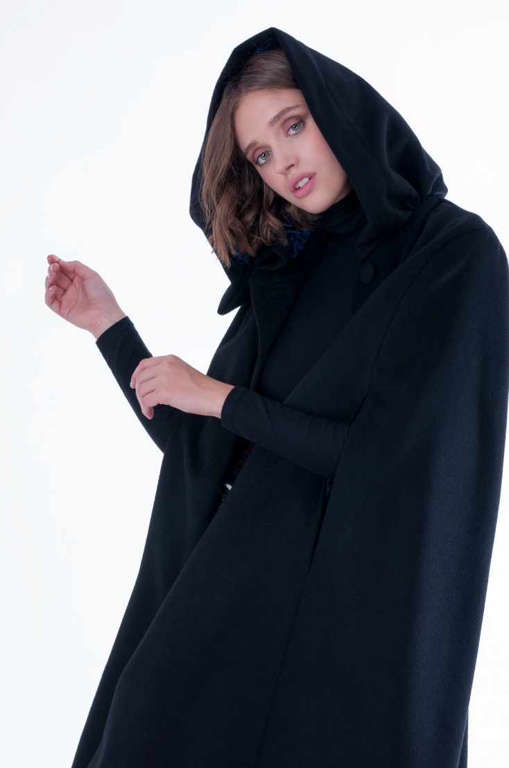NELDA – Black cape with hood and blue lining.
